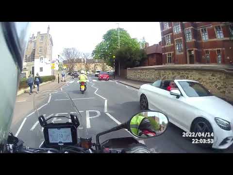 Two up idiots on an electric scooter