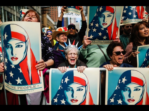 Click to Watch the 'I Am A Muslim Too': Angry protesters gather to declare allegiance to Islam and hate toward President Trump video