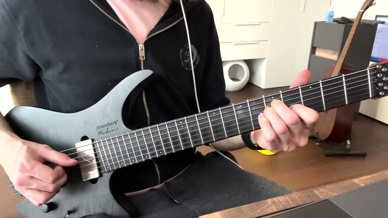 Guitarist demonstrating a right-hand riff combining fingerpicking, palm mutes and plucking