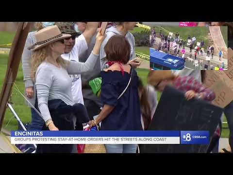 Encinitas group gathers to protest the closure of public spaces in San Diego.