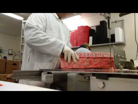 Butcher cutting T-Bones steak