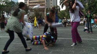 Hundreds join a fierce pillow fight in Hong Kong