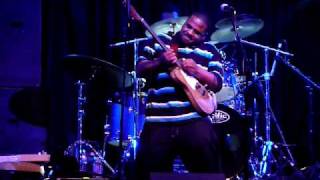 Tyree Neal plays with Kenny Neal's right hand guitar, upside down with his left hand