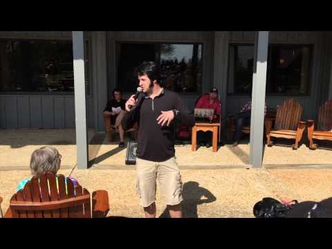 Travis Powell talking to crowd - video by Susan Quinn Sand