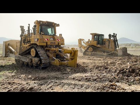 Two Caterpillar D9T Bulldozers Ripping & Pushing On Huge Mining Area