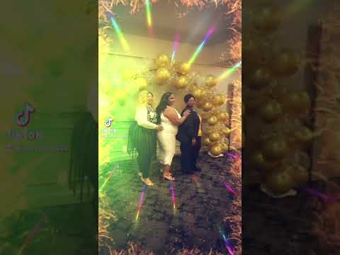 My aunts and my sister taking pictures at my nanny party .