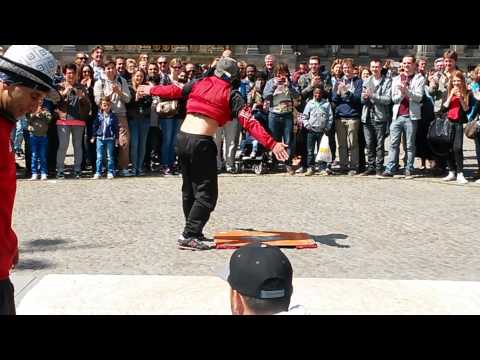 B boy doing headspin on the squere