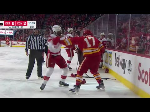 Milan Lucic drops the gloves with Givani Smith