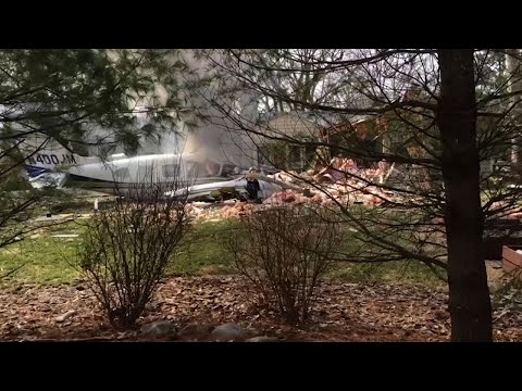 A small plane crashed into a suburban Cincinnati house Tuesday afternoon, killing the pilot and sending dark smoke billowing from the backyard. (March 13)