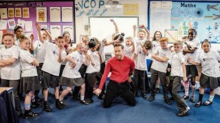 Watch as Olly Murs surprises children during their Premier League Writing Stars lesson