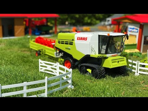 BRUDER TOYS - two combine harvesters and tractors with trailers at work! Video