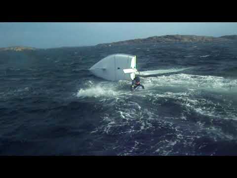 Laser dinghies gybe, followed by capsize in 25 kts wind