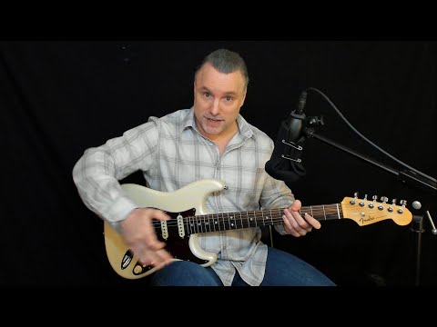 How to hold the electric guitar