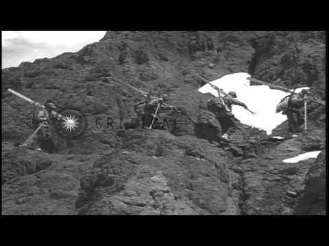 The skiers arriving near a rock and demonstrate the rock climbing techniques in t...HD Stock Footage