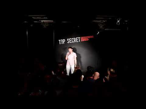 Sydney May live at the Top Secret Comedy Club London