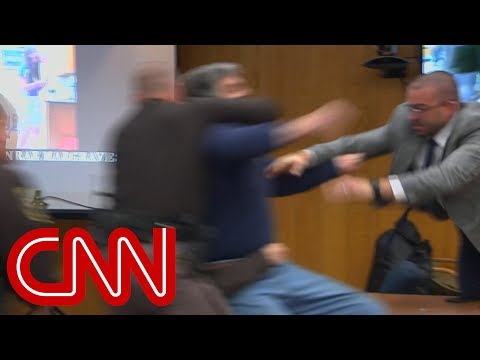 Father lunges at Larry Nassar in court