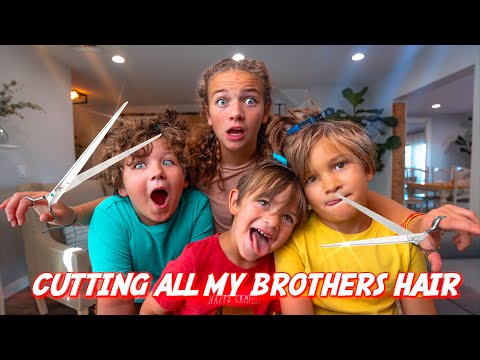 Four kids with surprised expressions pose with large scissors toward the camera, a playful home video thumbnail.