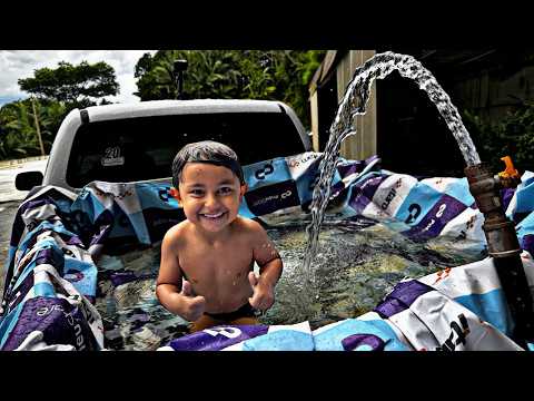 Kauã and I made a swimming pool in the back of the pickup truck…