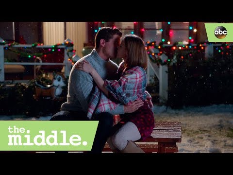 Sue and Sean Kiss- The Middle