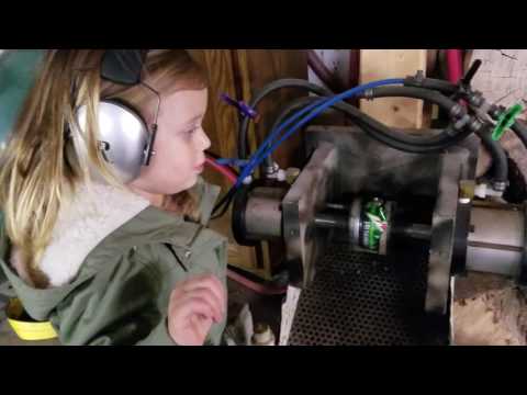 Kid using pneumatic can crusher