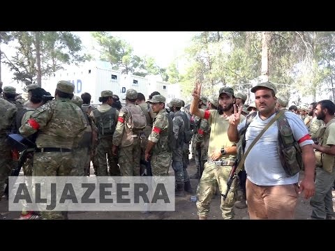 Syrian rebels and Turkish tanks 'seize' ISIL-held town