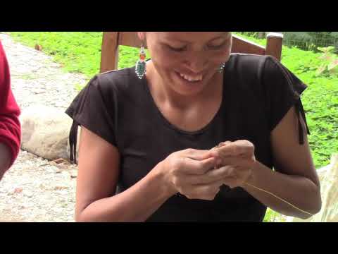 Belgica and Elodia prepare paintbrushes