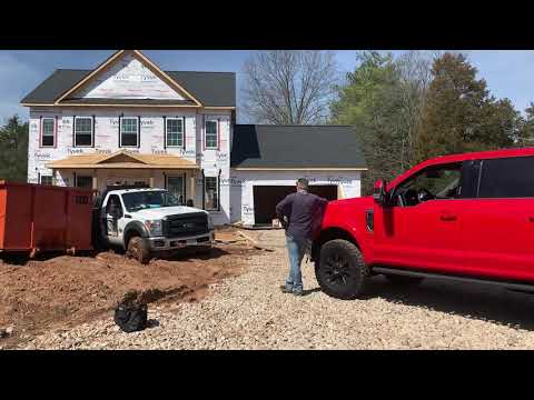Ford F-250 Tremor to the rescue.  Warn 12K vs welding truck buried to the axles.