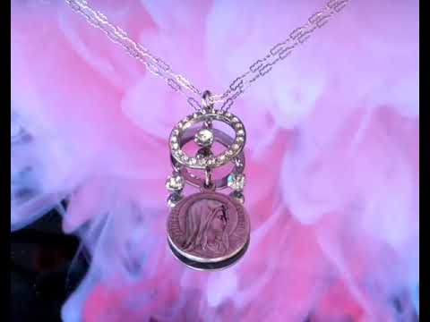 New product video of our handmade Virgin Mary necklace with an antique French medal.
