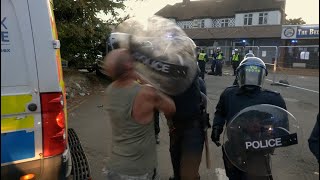 “You knocked my fu**ing teeth out!” Moment riot police smash shield into man's face in Epping clash