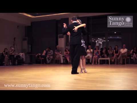  Alexandros Palaiologos  and  Ivon Carolina  are  dancing  to  the  tango  "  Infamia  "  by  Juan D'Arienzo  at  Sunny Tango Festival  in  2014