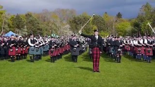 Massed Pipe Bands salute the Chieftain during the 2016 North of Scotland Competition in Banchory