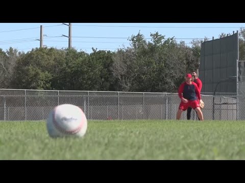St. Louis Cardinals officials talk during Spring Training