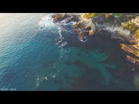 Trailer still: grey sky over the Pacific as 'Come Clean' synths tease the drop