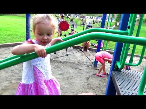 Children playing at an outdoor playground  kids having fun at the park