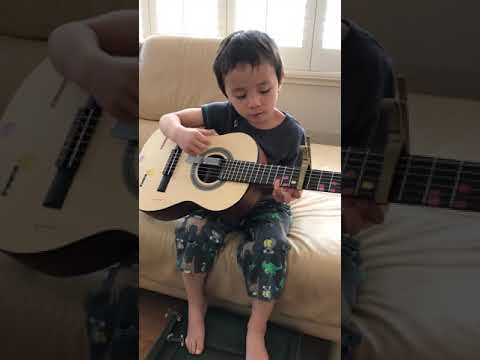 Milo plays and sings You Are My Sunshine on guitar 4 years old