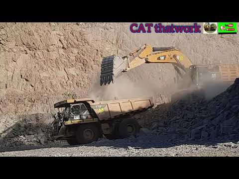 CATERPILLAR 390FL AND 775F @ WORK (HEAVY EQUIPMENT WORKING IN MINES)CAT thatwork