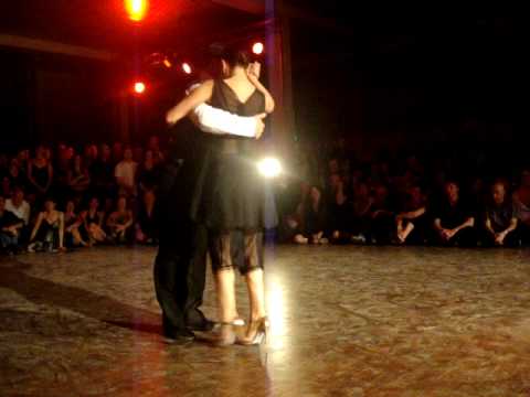  Esteban Moreno  and  Claudia Codega  are  dancing  to  a  milonga