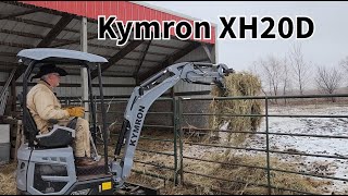 Mini-Excavator Kymron XH20D Moving Hay