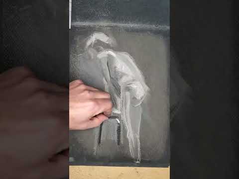 Art lesson: nude male model with stool.