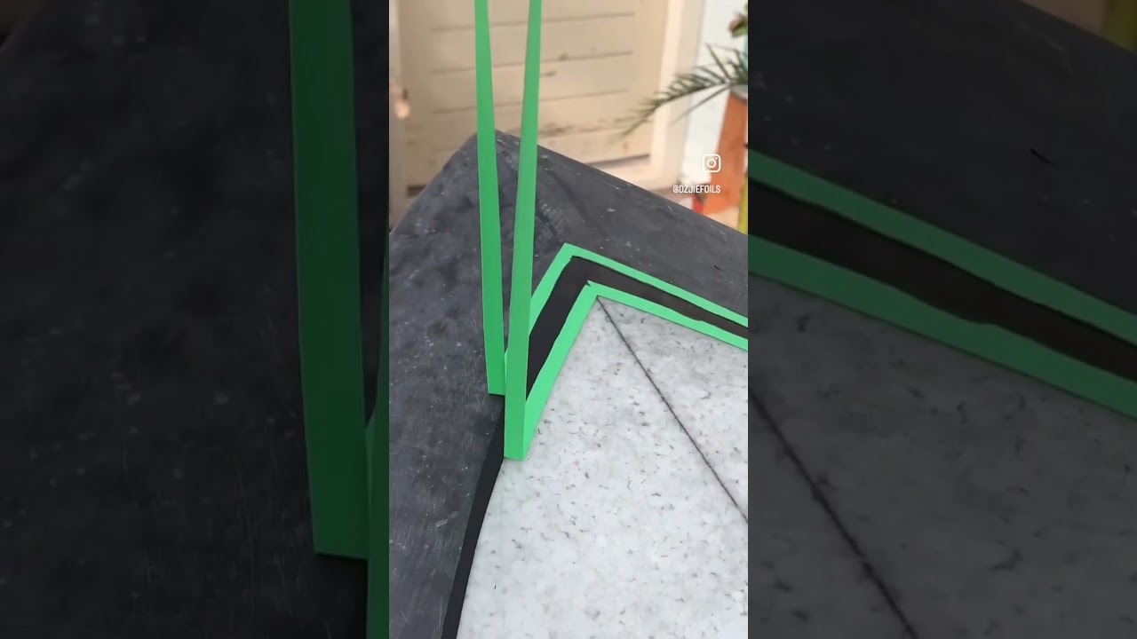 Drawing a pin line on a surfboard