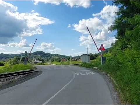 Railroad crossing in Croatia with signal and barrier - Pružni prijelaz sa signalom i rampom