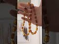 A 100 Million year old amber necklace! Look at how it changes color.