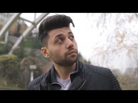 Man sad bored in forest park trees and thinking looking at leavs - No Watermark iStock Footage Video