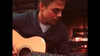 Derek plays on the guitar