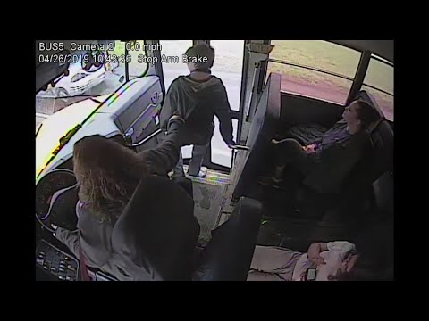 A fast-acting school bus driver is being lauded for grabbing a student by the back of his jacket as he was about to step out into the path of a passing car.