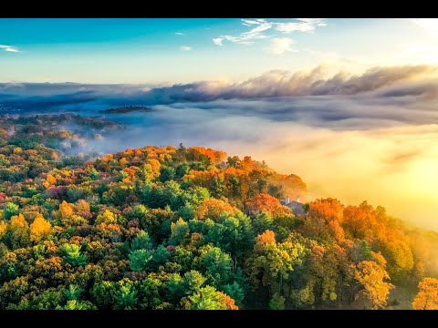 Misty autumn sunrise sunset over Avon mountain