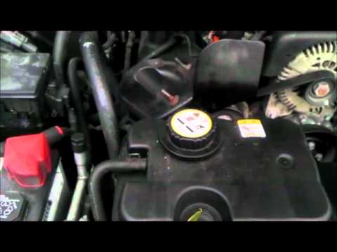 Coolant Flush and Thermostat Exchange on a Ford Panther Platform vehicle