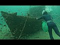 diving to explore the sunken wooden ship