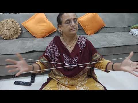 Bharati making hammock or cat's cradle - string figure