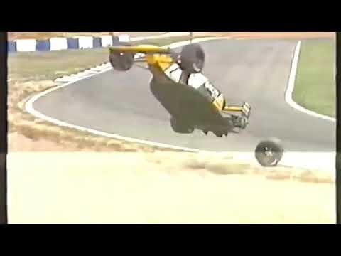 1990 F1 Spanish GP -  Pierluigi Martini's Minardi loose wheel while being craned